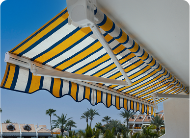Striped awning over sunny patio scene.